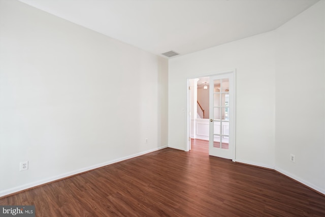 empty room featuring dark wood-type flooring