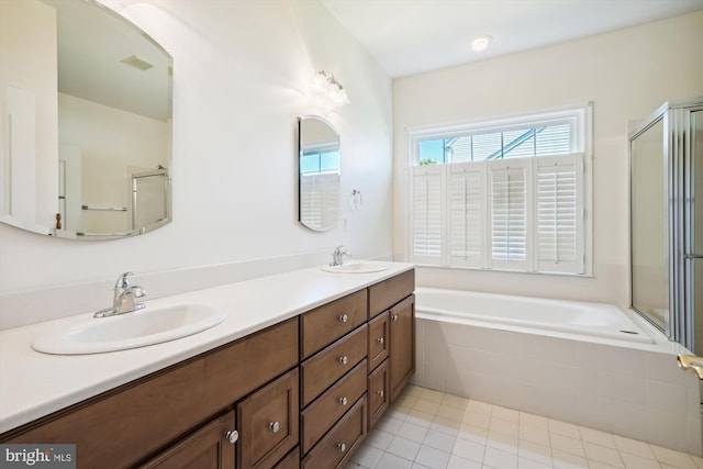 bathroom with tile patterned floors, plus walk in shower, and vanity