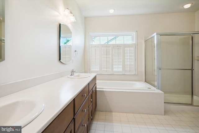 bathroom with tile patterned floors, vanity, and independent shower and bath