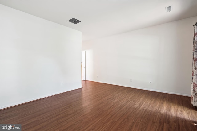 empty room featuring dark hardwood / wood-style floors