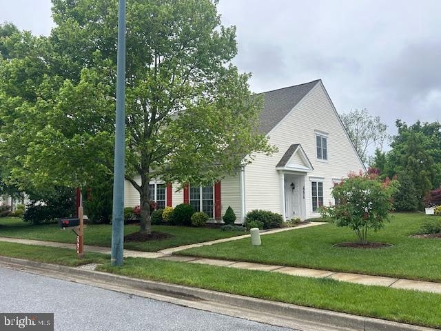 view of front of home with a front yard