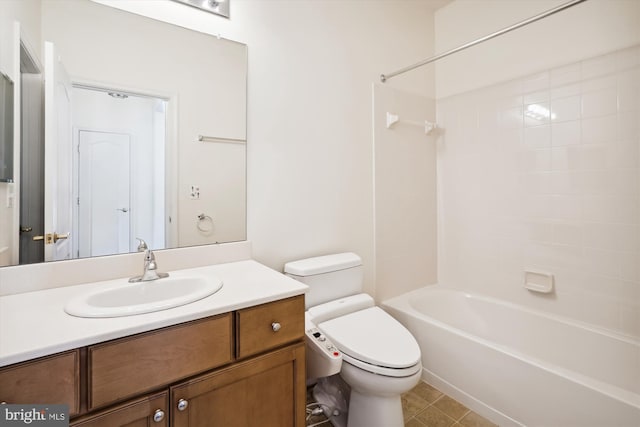 full bathroom featuring vanity, toilet, and tiled shower / bath