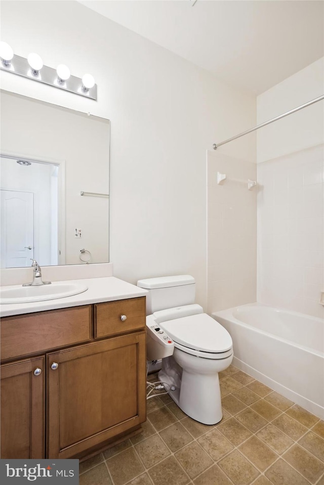 full bathroom featuring tile patterned flooring, vanity, shower / bathtub combination, and toilet