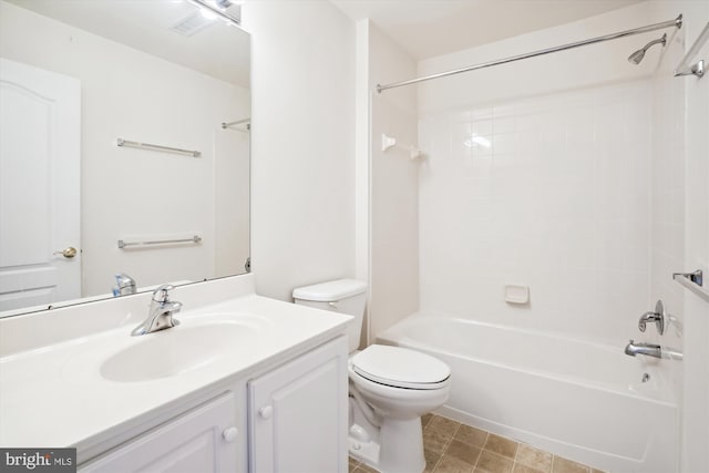 full bathroom with vanity, toilet, and tiled shower / bath