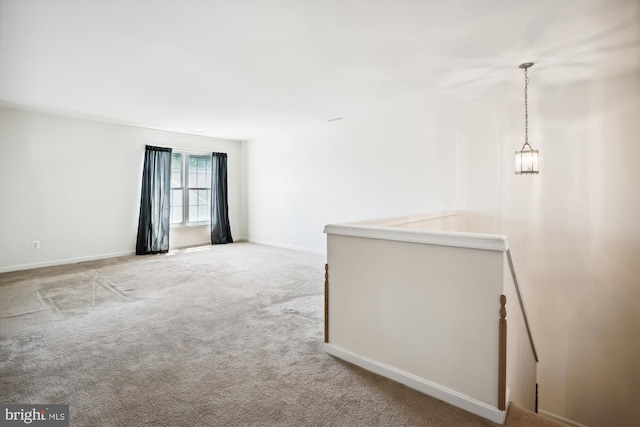 empty room featuring light carpet