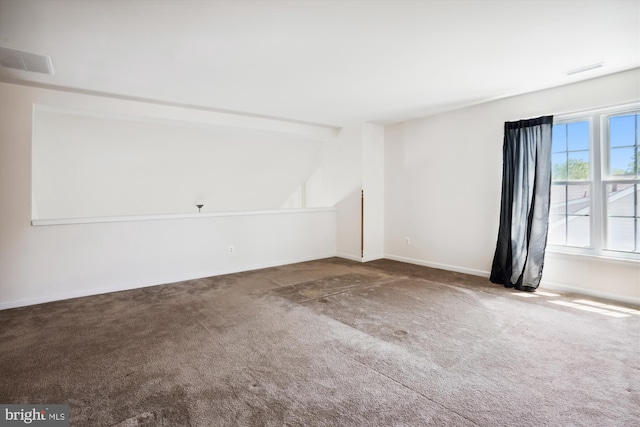 spare room featuring carpet floors