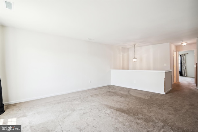 unfurnished room featuring carpet floors