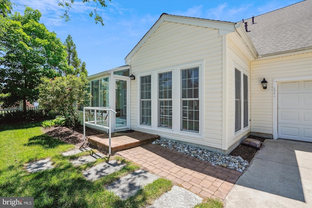 view of property exterior featuring a garage