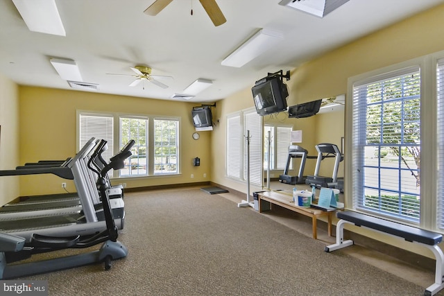 gym featuring carpet, plenty of natural light, and ceiling fan