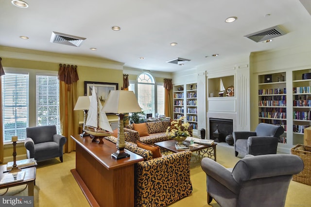 carpeted living room with built in shelves, plenty of natural light, and crown molding