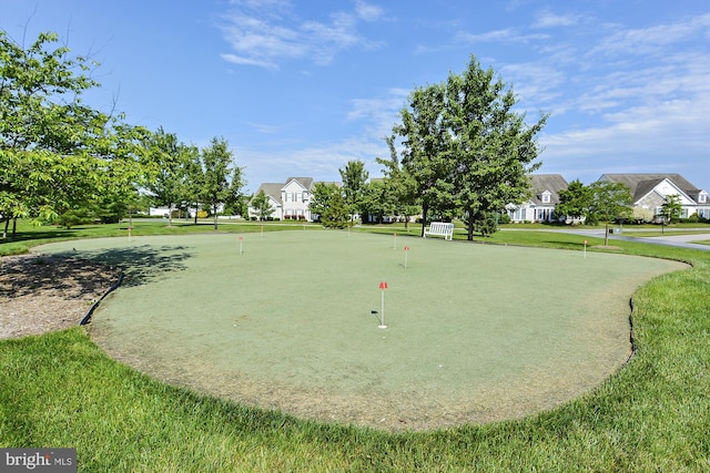 view of home's community featuring a lawn