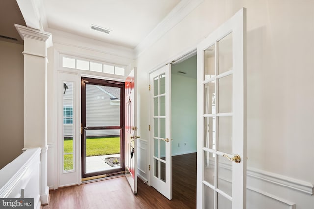 doorway to outside featuring french doors, ornamental molding, and hardwood / wood-style floors