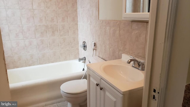 bathroom with backsplash, vanity, tile walls, and toilet