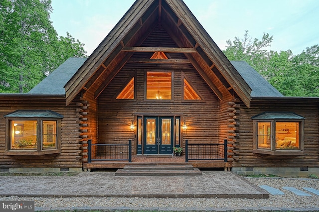 view of front of property with french doors and a porch