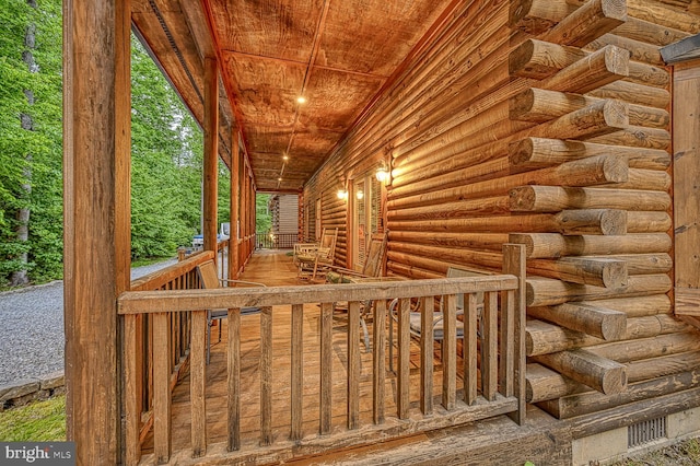 wooden deck featuring covered porch