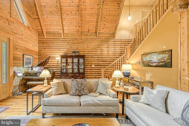 living room with rustic walls, high vaulted ceiling, wood ceiling, and hardwood / wood-style flooring