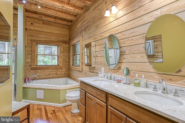 bathroom with wooden ceiling, wood walls, hardwood / wood-style floors, toilet, and a bathtub