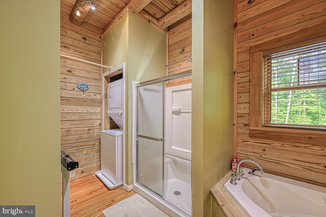 bathroom with wood-type flooring, lofted ceiling with beams, wooden ceiling, and wood walls