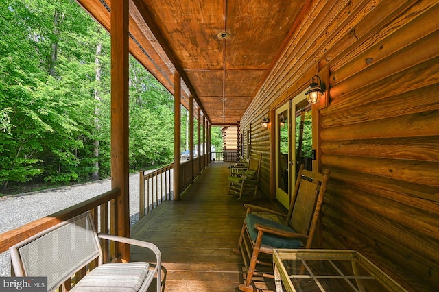 wooden terrace with a porch