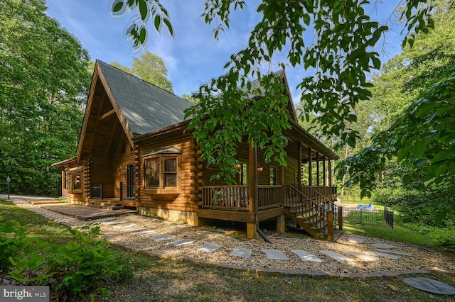 view of side of property featuring a deck