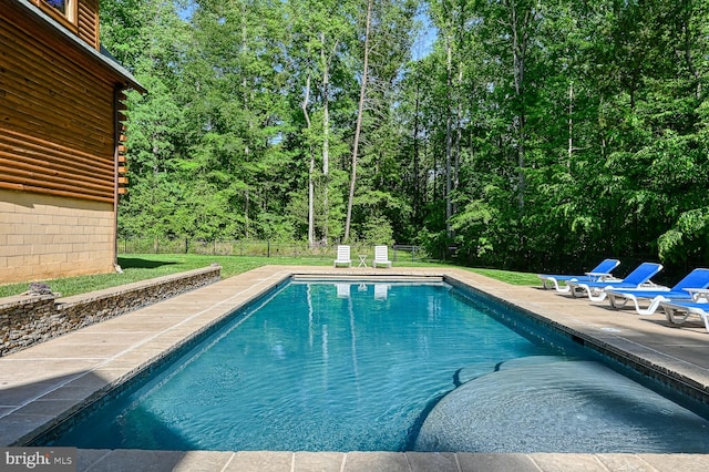 view of swimming pool featuring a patio