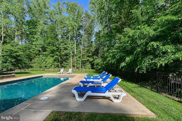 view of swimming pool with a patio