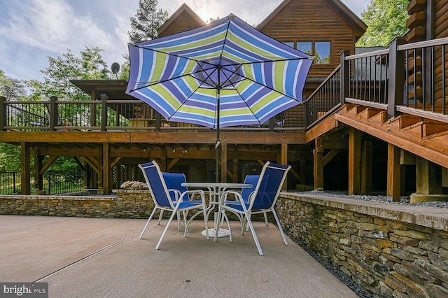 exterior space featuring a deck and a patio