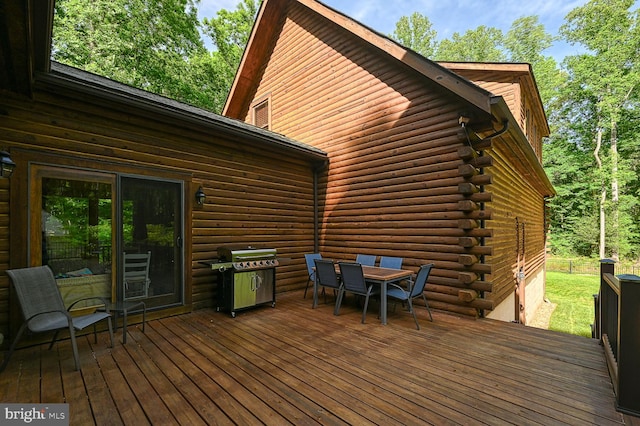 wooden deck featuring grilling area