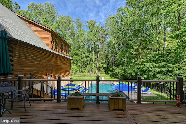 deck featuring a pool