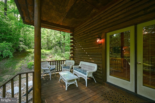 wooden deck featuring an outdoor hangout area