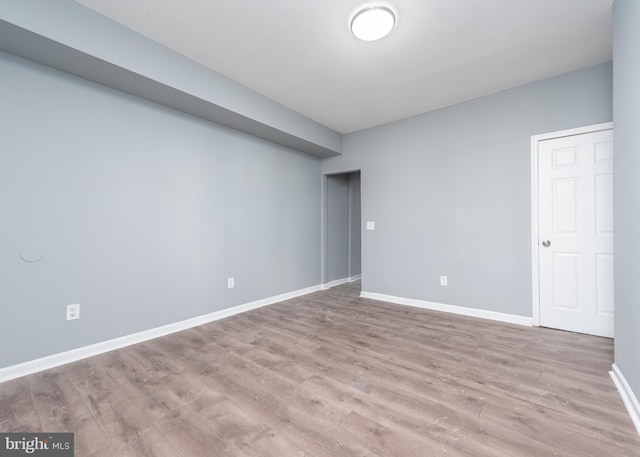 spare room featuring hardwood / wood-style floors