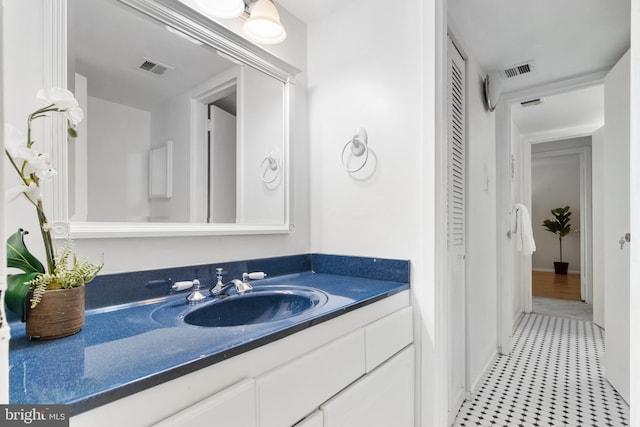 bathroom with tile patterned flooring and vanity