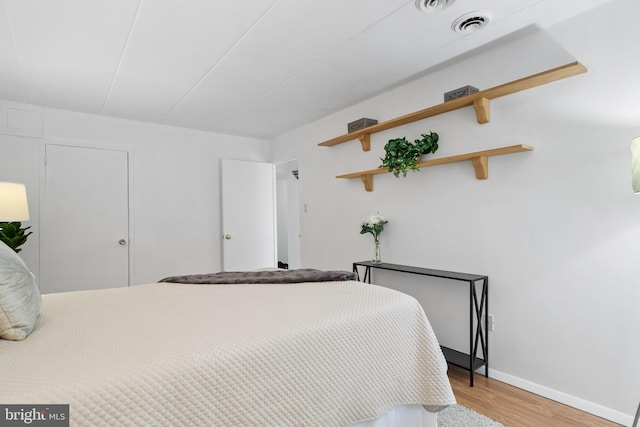 bedroom with light hardwood / wood-style floors