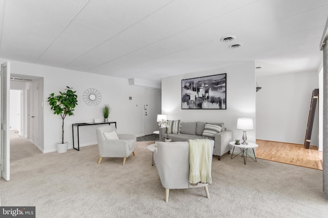 living room with light colored carpet