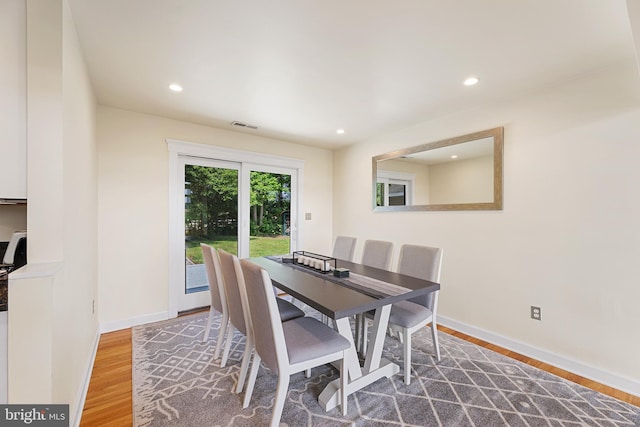 dining area with hardwood / wood-style flooring