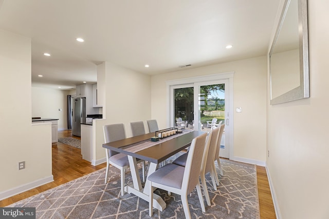 dining room with hardwood / wood-style flooring