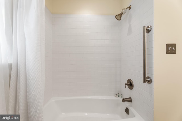 bathroom featuring shower / bath combo with shower curtain