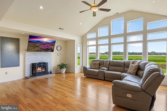 living room featuring light hardwood / wood-style floors, plenty of natural light, and ceiling fan