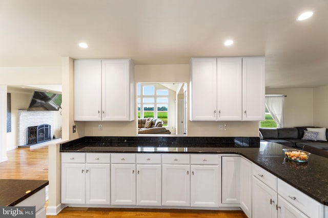 kitchen with white cabinets and a wealth of natural light