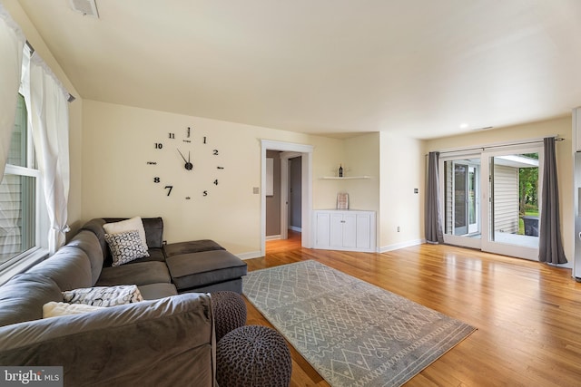 living room with light hardwood / wood-style floors