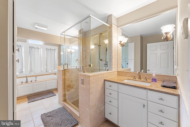 bathroom featuring tile patterned floors, vanity, and an enclosed shower