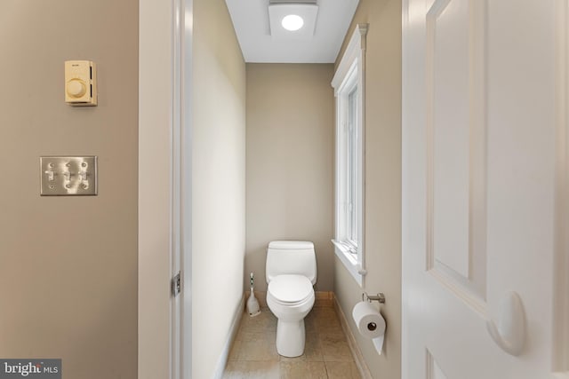 bathroom featuring tile patterned floors and toilet