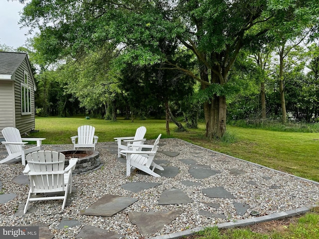 view of patio / terrace featuring an outdoor fire pit