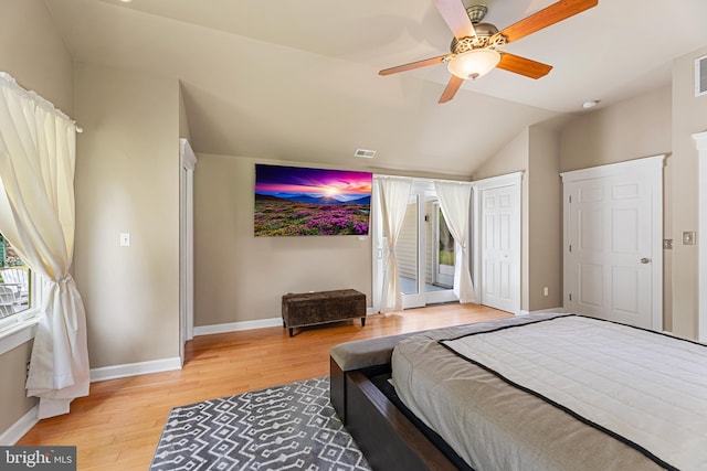 bedroom with ceiling fan, light hardwood / wood-style floors, access to exterior, and vaulted ceiling