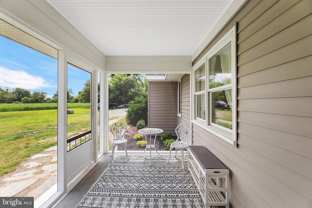 sunroom / solarium featuring plenty of natural light