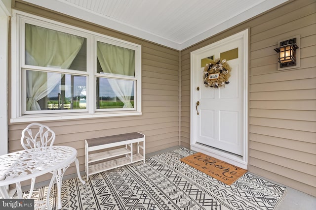 property entrance featuring covered porch