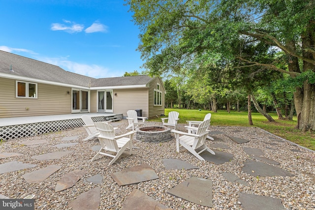 view of patio with an outdoor fire pit and a wooden deck