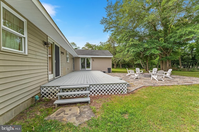 view of yard featuring a fire pit and a wooden deck