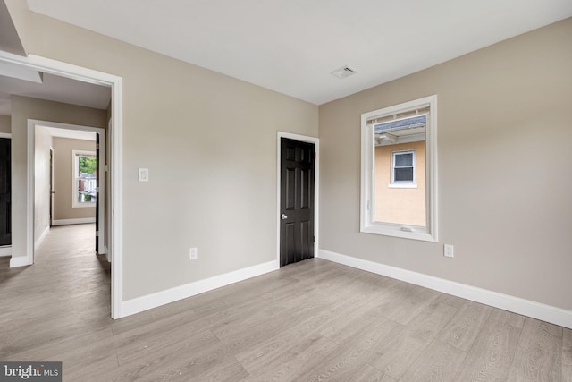 empty room with light wood-type flooring