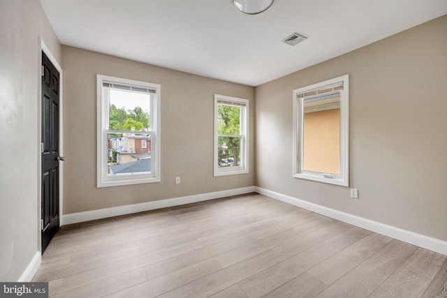 empty room with light wood-type flooring